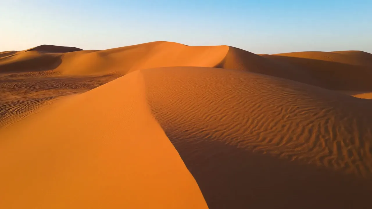 Sahara Desert Rippling Sand Dunes - Sahara desert sand dunes with perfect ripple patterns. 8K nature photography, professional landscape lighting, no movement transitions, perfect exposure for each environment, natural color grading  - AI video generated with Veo 3