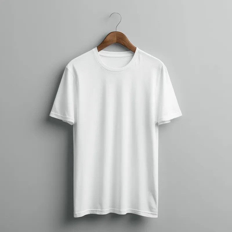 T-Shirt Mockup - A high-quality mockup of a plain white t-shirt displayed on a hanger. The background is a minimalist, light-grey studio setting to highlight the design. The t-shirt is centered, with soft shadows giving it a realistic look. There are no logos or designs on the t-shirt to allow for customization in post-editing.